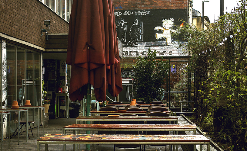 The Canteen terrace underneath Banksy's Mild, Mild, West